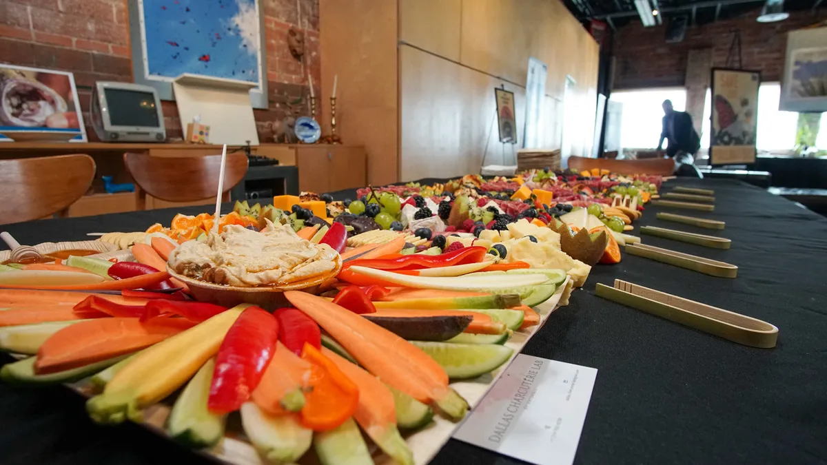 Platters of vegetables arranged along a table at the event