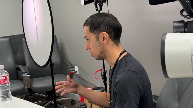 Behind the scenes: directing an interview beside a studio reflector